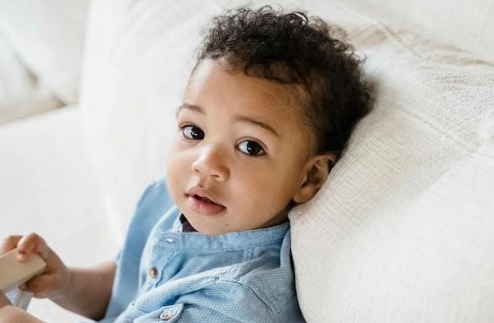 baby sitting on the couch