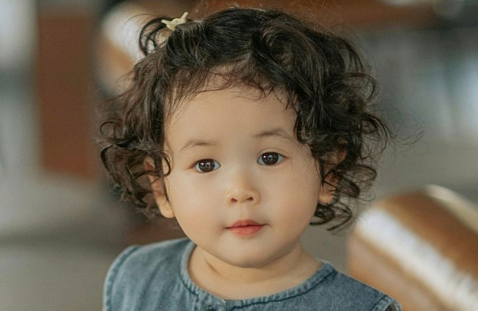 baby with curly hair