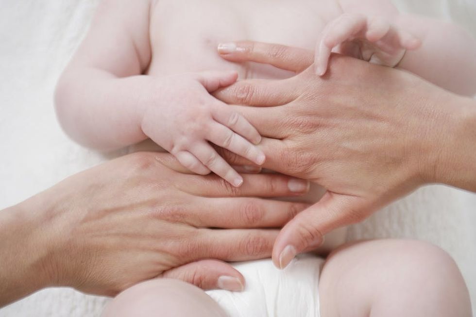 Baby with parent hands