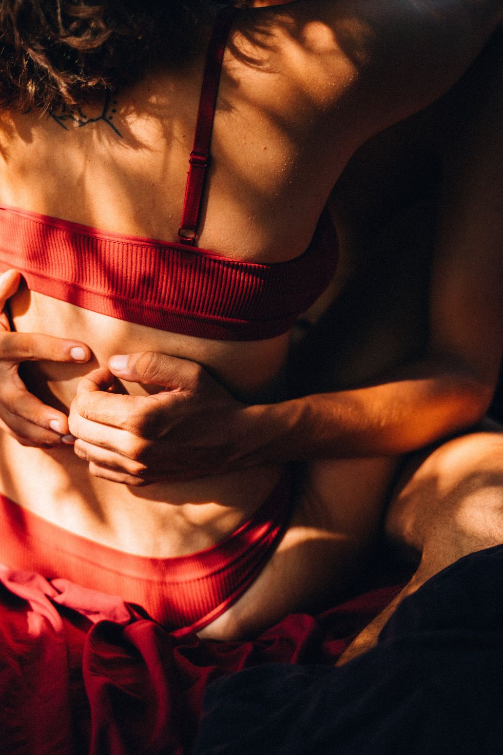 back of a woman with hands touching her