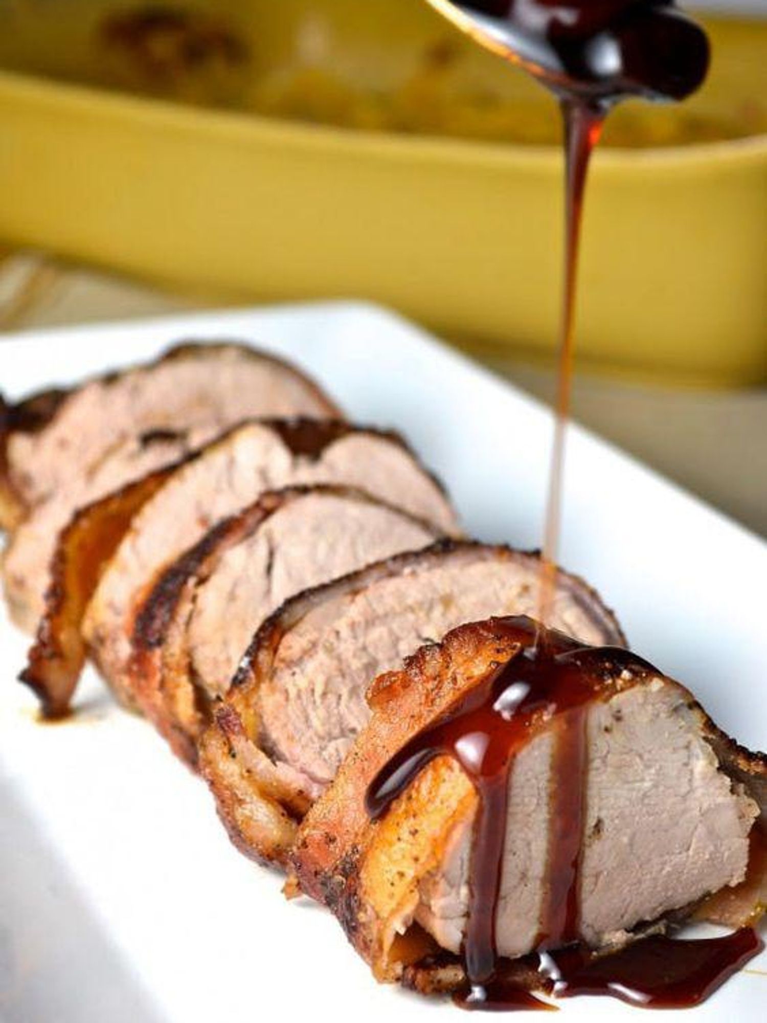 Bacon Wrapped Pork Tenderloin With Cherry Bourbon Sauce