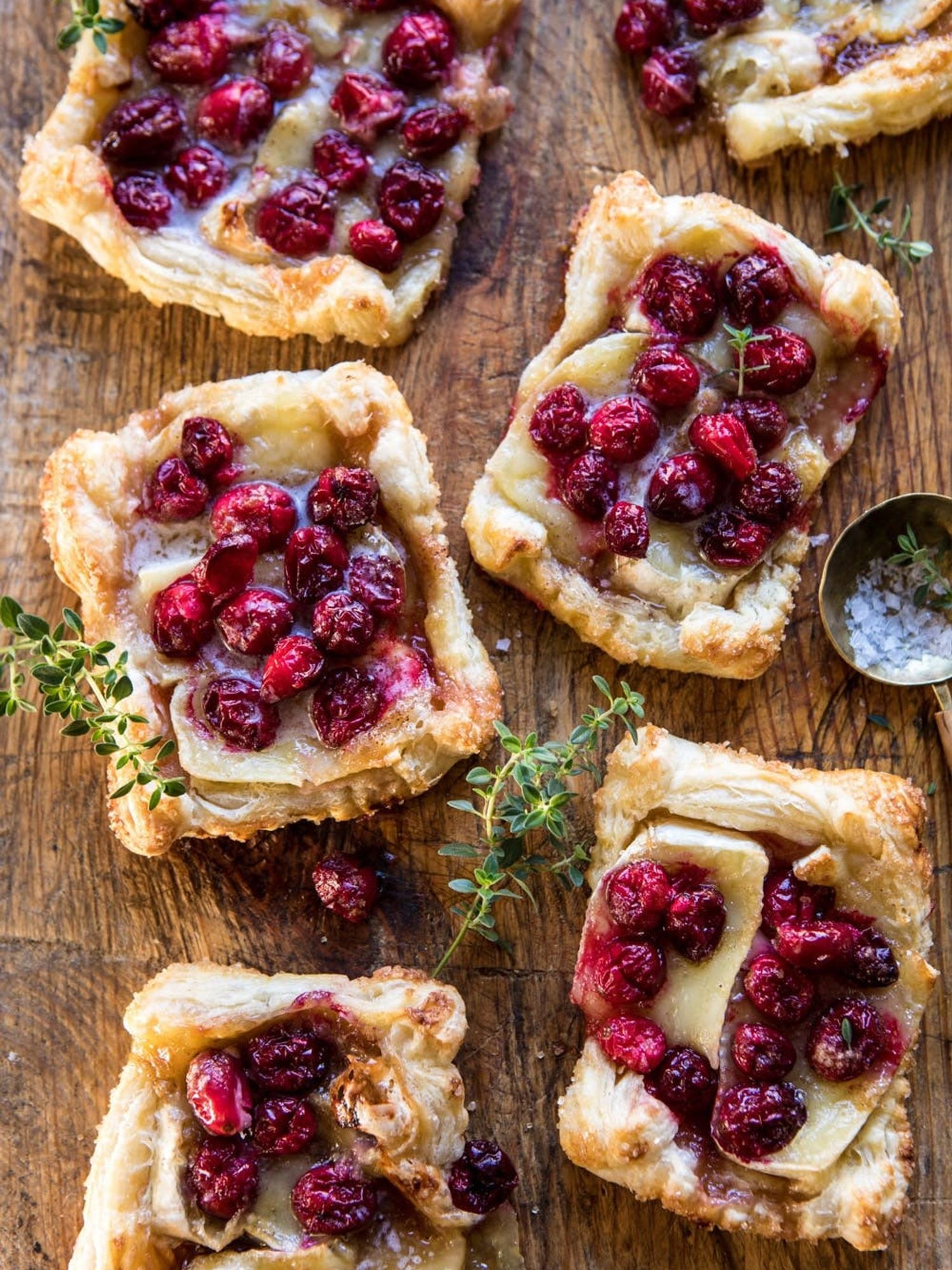 Baked Cranberry Brie Pastry Tarts on a wooden table