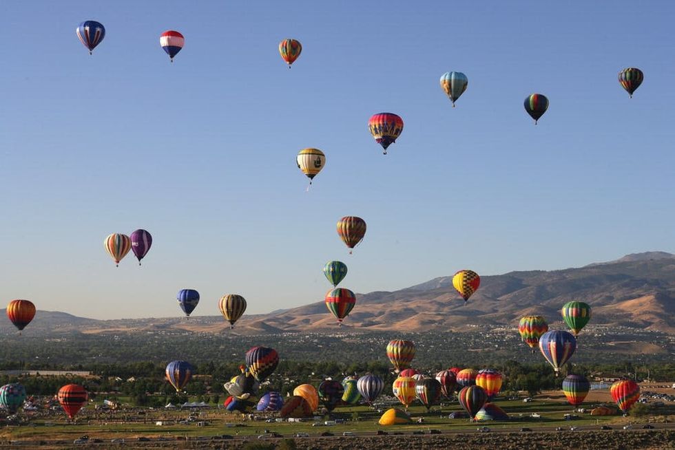 Balloons fill the morning sky during the Great Reno Balloon Race