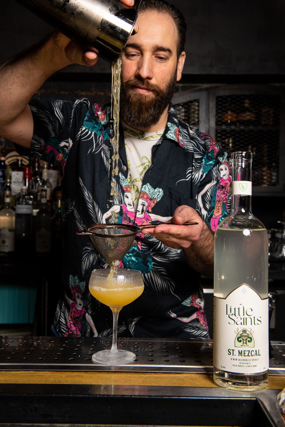 bartender Nikola Nikoletic pouring the jaguar's coupe