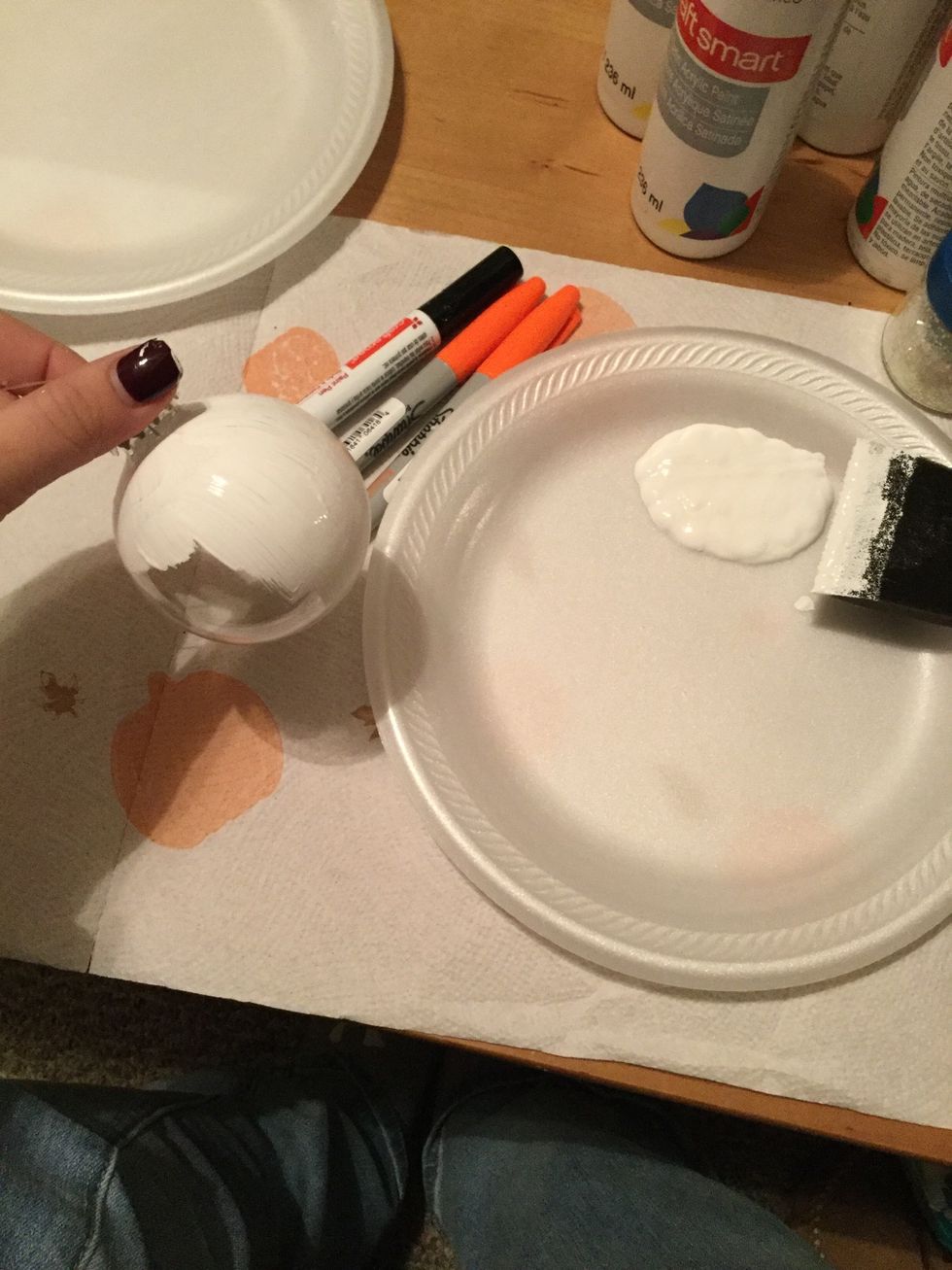 Begin painting the first coat on your ornament