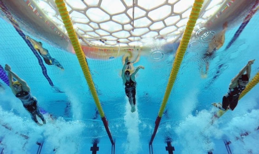 BEIJING - AUGUST 14: (L-R) Lisbeth Trickett of Australia, Britta Steffen of Germany and Natalie Coughlin of the United States competes in the Women's 100m Freestyle Semifinal 1 at the National Aquatics Centre during Day 6 of the Beijing 2008 Olympic Games on August 14, 2008 in Beijing, China. (Photo by Al Bello/Getty Images)