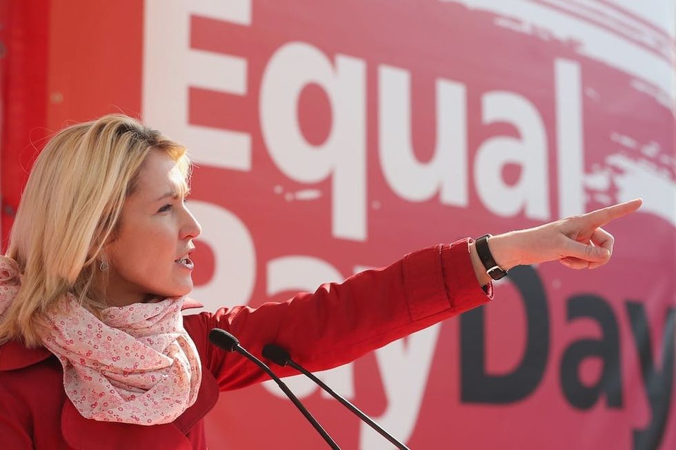 BERLIN, GERMANY - MARCH 20: German Family Minister Manuela Schwesig speaks to men and women rallying for equal pay for women compared to men on Equal Pay Day on March 20, 2015 in Berlin, Germany. Income for women still lags behind that of men for equivalent jobs across the German employment spectrum. (Photo by Sean Gallup/Getty Images)