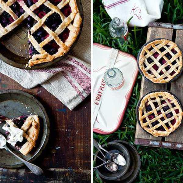 berry pie on wooden table with maroon striped napkins
