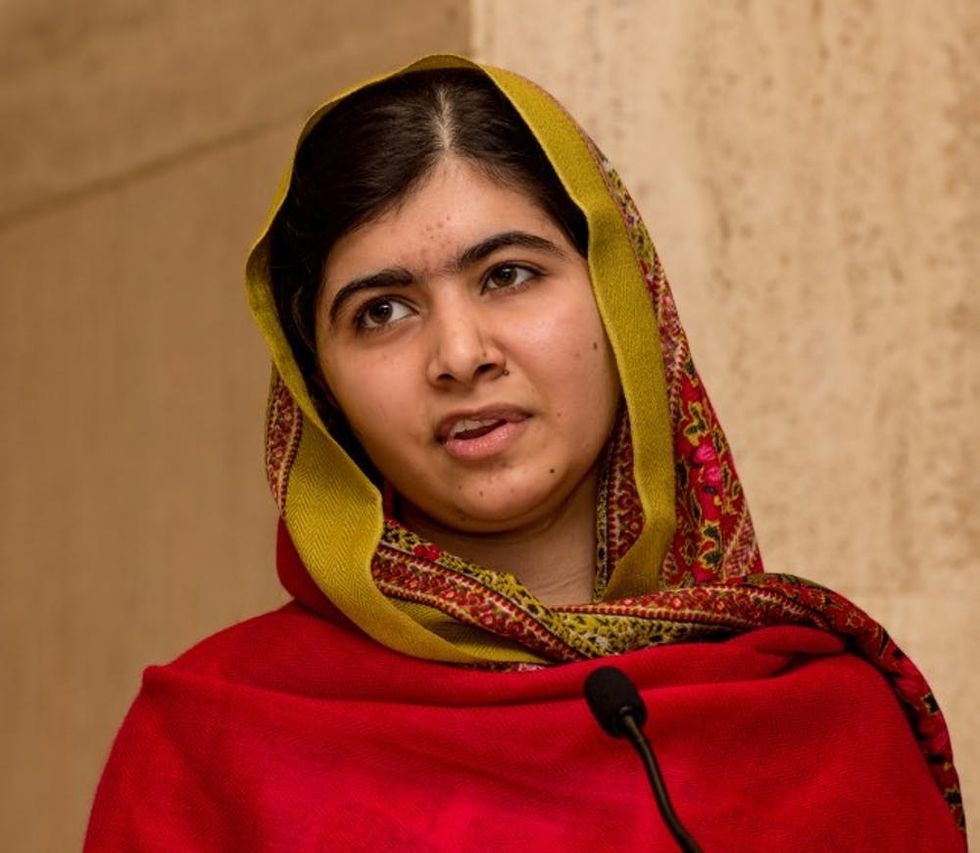 BIRMINGHAM, ENGLAND - NOVEMBER 29: Malala Yousafzai gives a speech as she unveils her official portrait by artist Nasser Azam at Barbar Institute Of Fine Art on November 29, 2015 in Birmingham, England. (Photo by Richard Stonehouse/Getty Images)