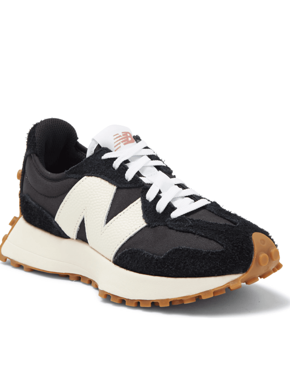 Black and white sneaker with gum sole and large side logo.