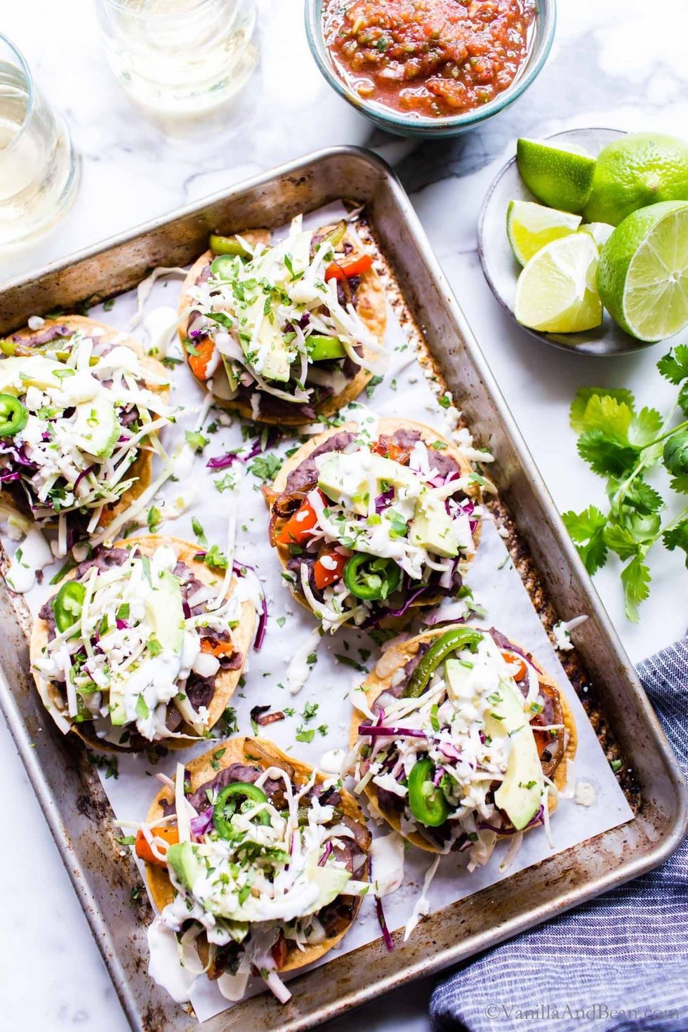 Black bean tostadas are on a pan.