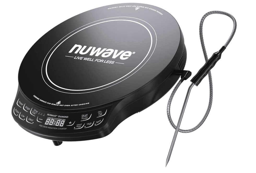 Black induction cooktop with digital controls and a temperature probe attached.