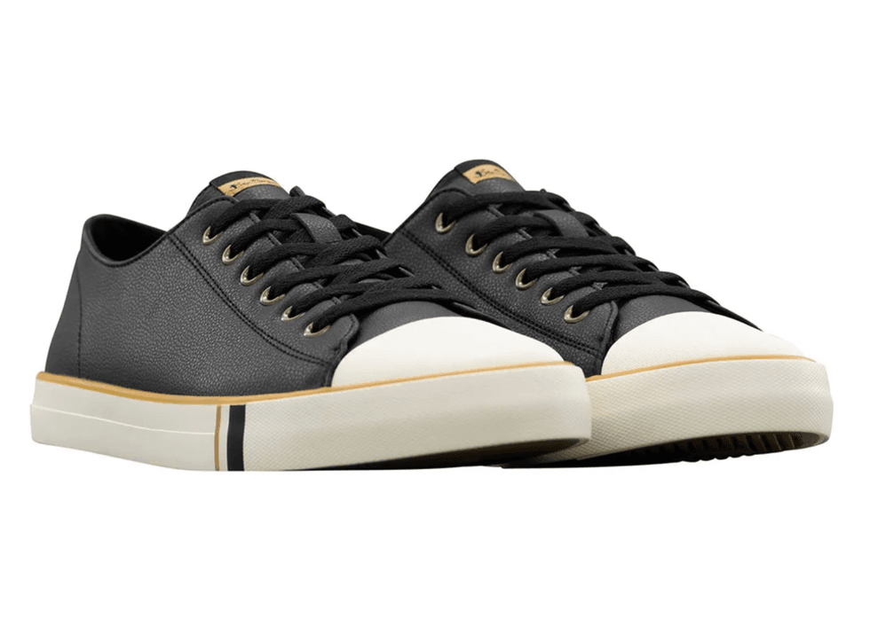Black low-top sneakers with white soles and toe caps.