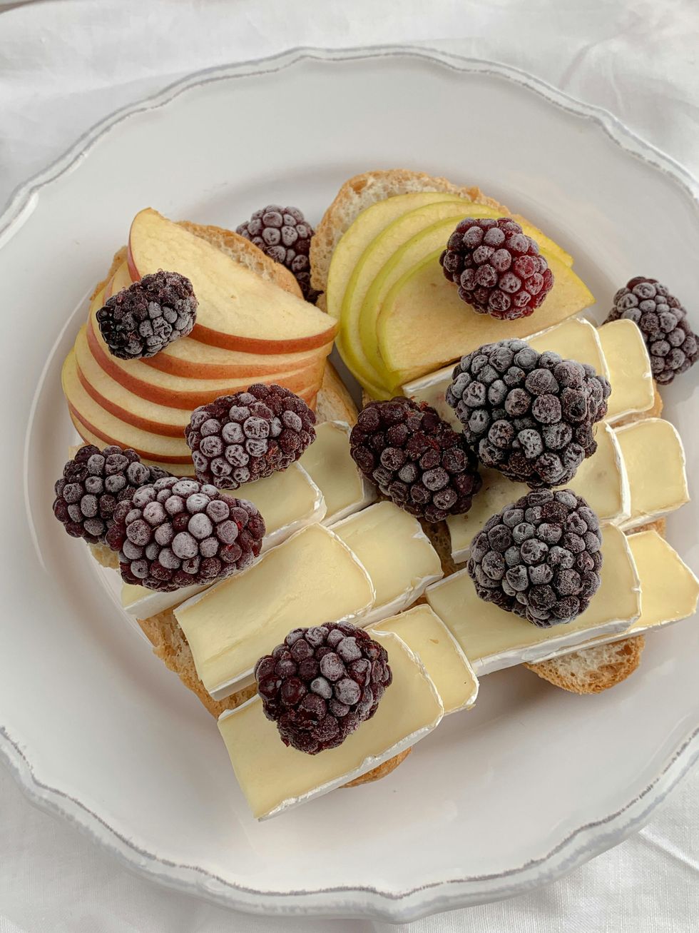 blackberries with cheese on a plate