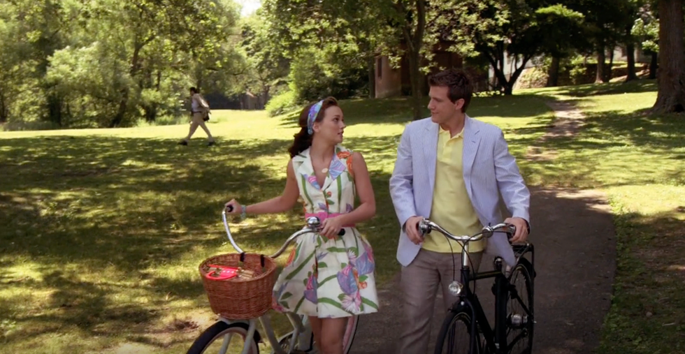 blair waldorf wearing a floral dress and marcus walking through the park in an episode of gossip girl