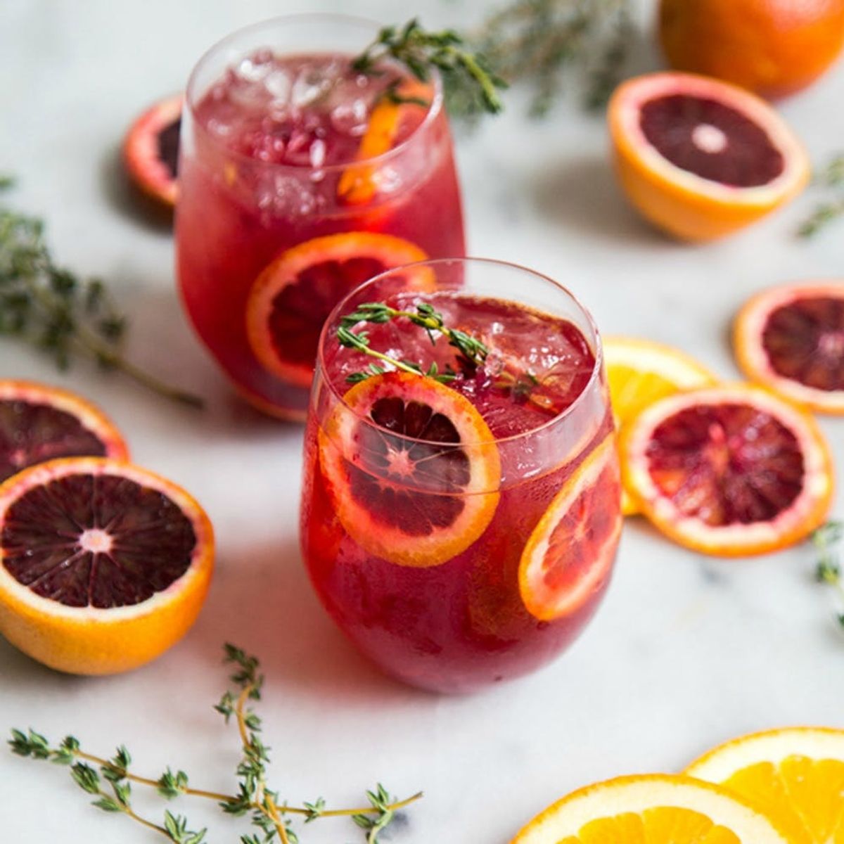 Blood Orange Cocktails feature thyme in a stemless wine glass