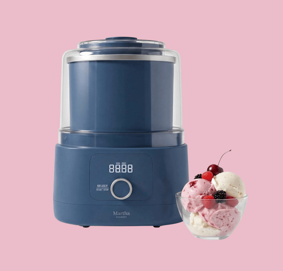 Blue ice cream maker with digital display and a bowl of mixed berry ice cream.