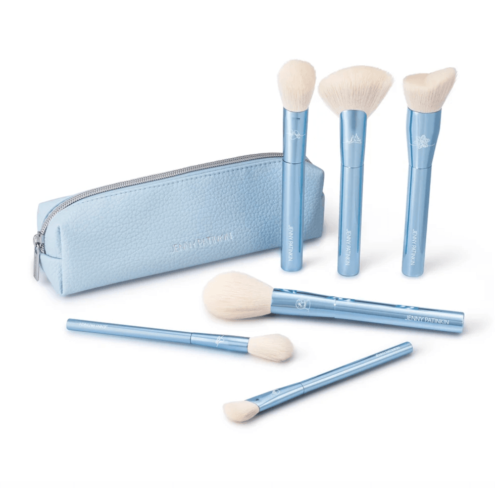 Blue makeup brushes and pouch set, featuring five brushes with white bristles.
