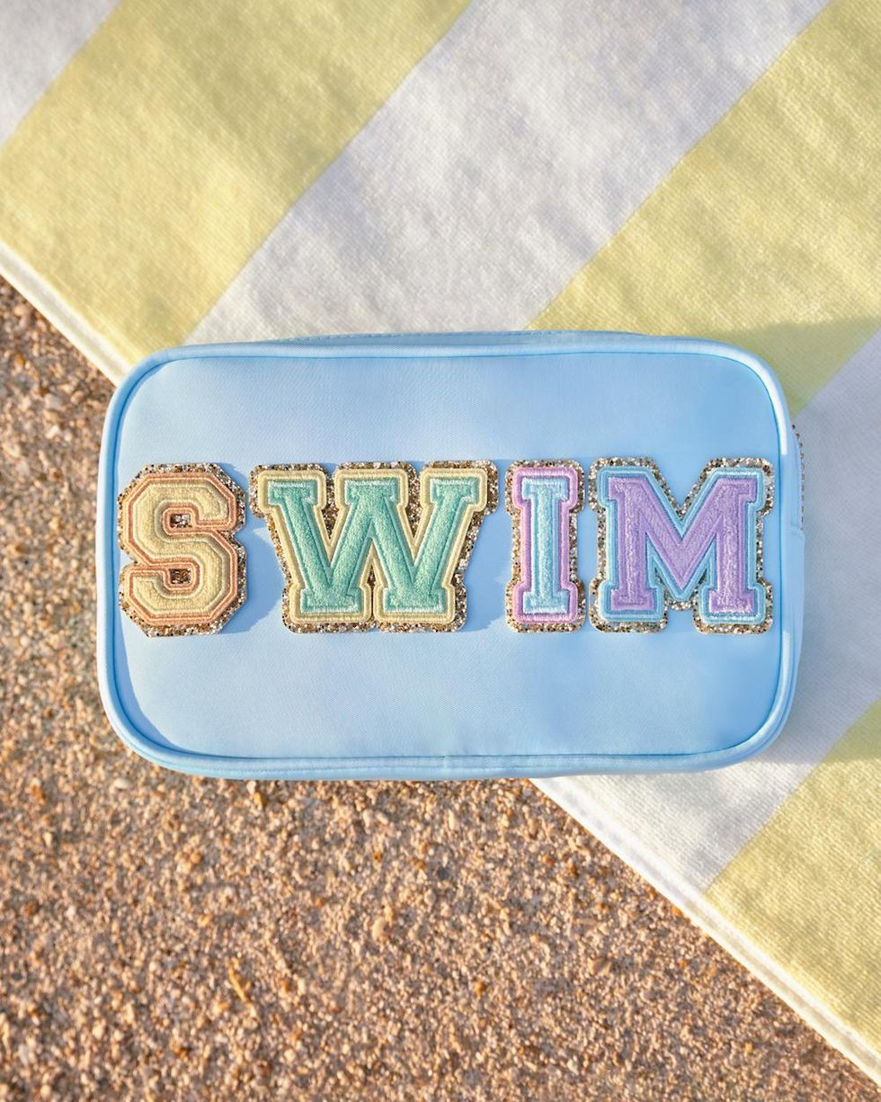 blue pack with colorful swim letters on it