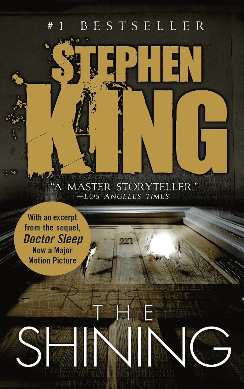 Book cover: Stephen King's "The Shining," features a distressed wooden door and bold title text.