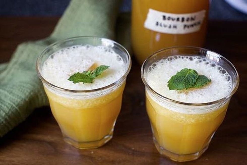 bourbon slush punch with tea, mint, and orange and lemon