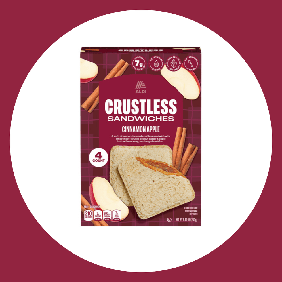 Box of Aldi Cinnamon Apple Crustless Sandwiches with cinnamon sticks and apple slices.