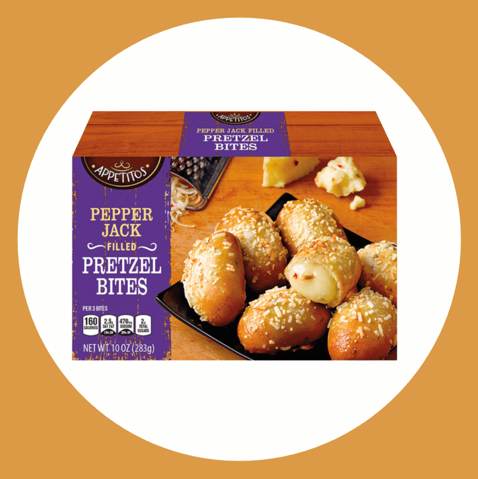 Box of pepper jack filled pretzel bites on a wooden surface.