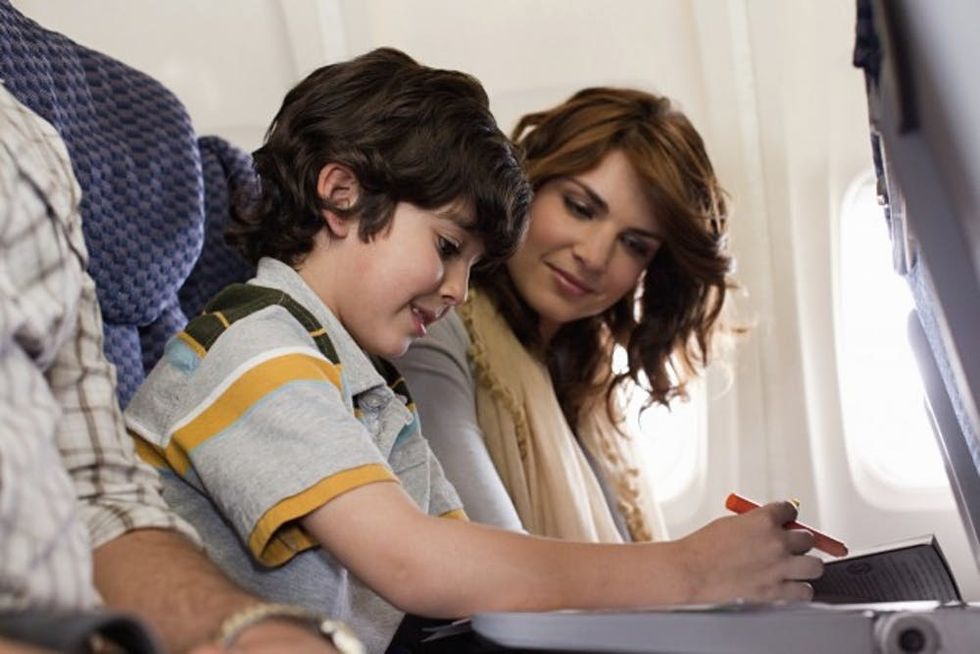 Boy and parents on airplane