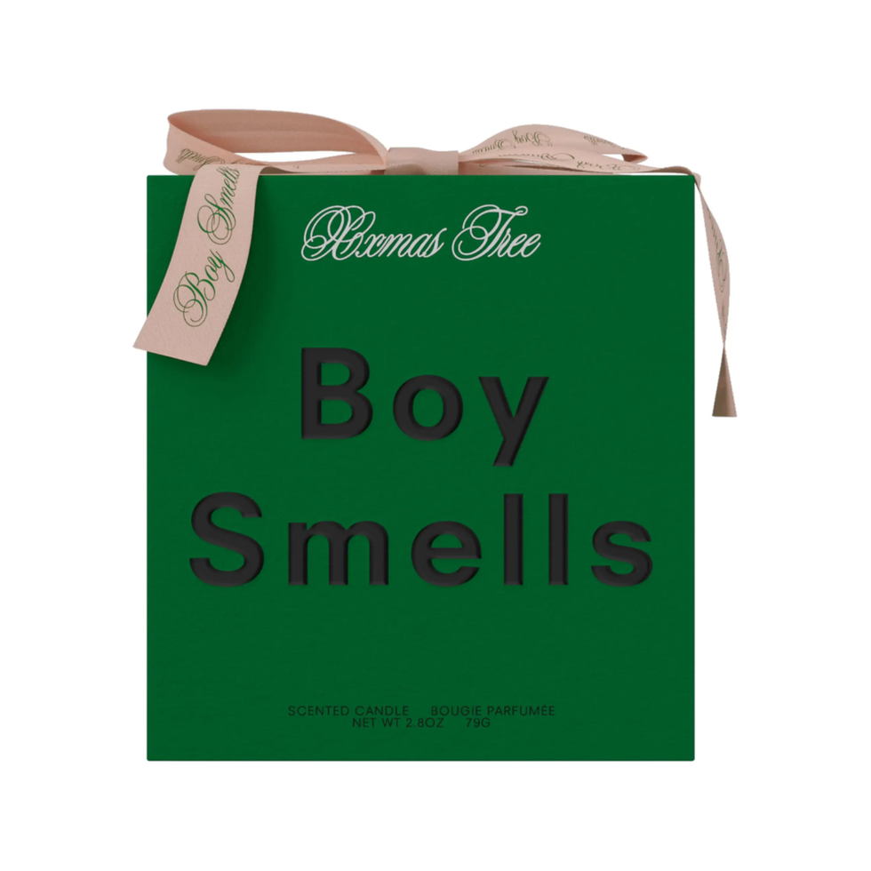 Boy Smells Christmas Tree Candle
