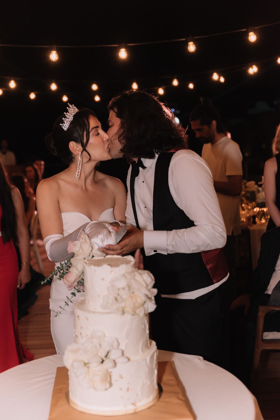 bride and groom slicing cake at wedding