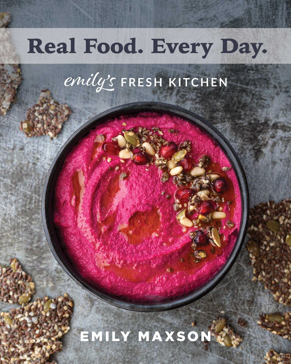 Bright pink dip with seeds and nuts, surrounded by crunchy crackers.