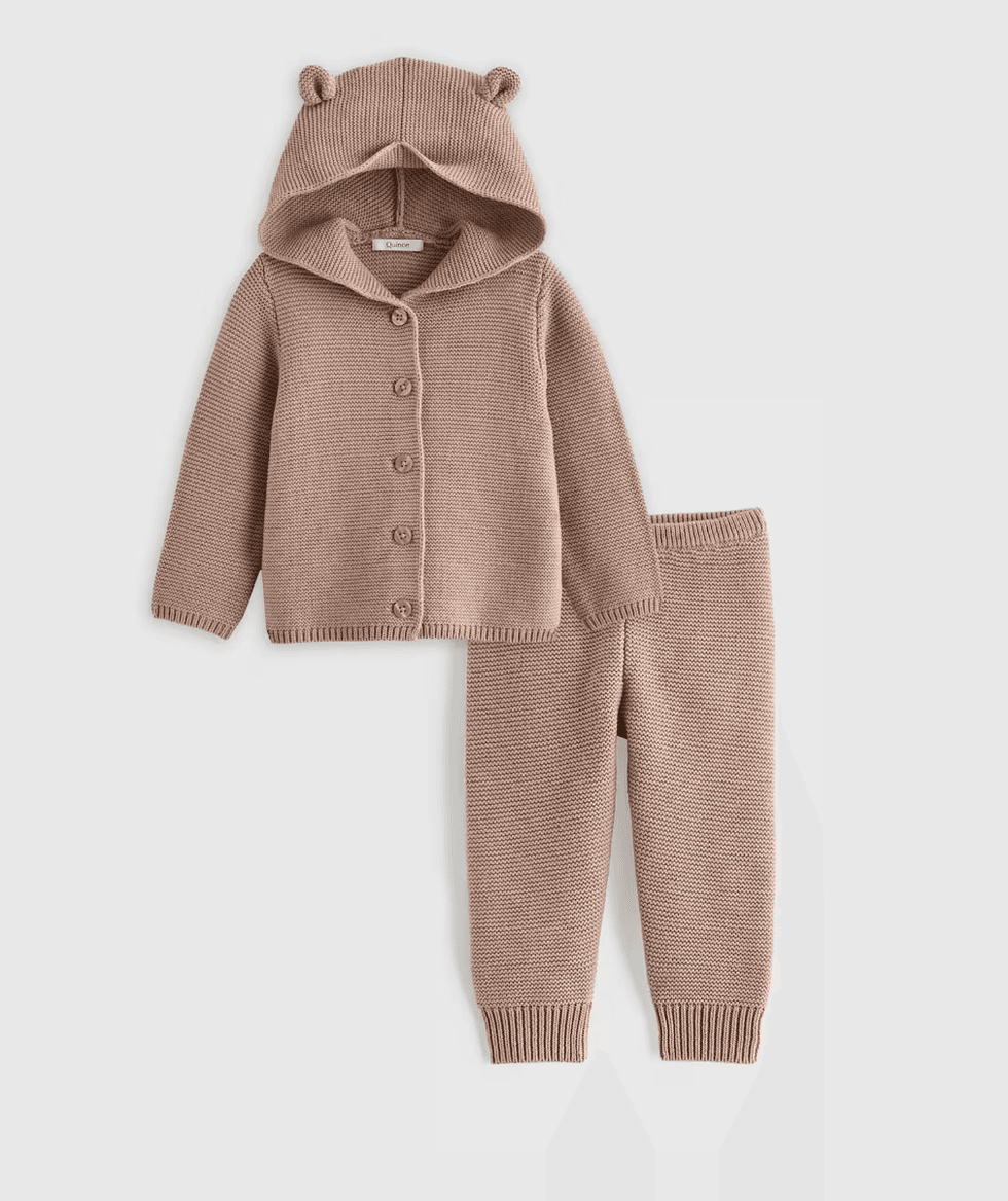 Brown knitted baby outfit with bear-ear hood and buttons, including matching pants.