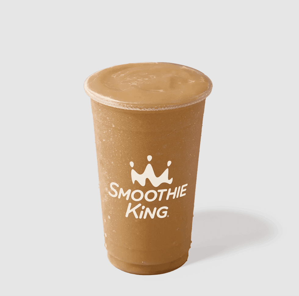 Brown smoothie in a Smoothie King cup on a light background.