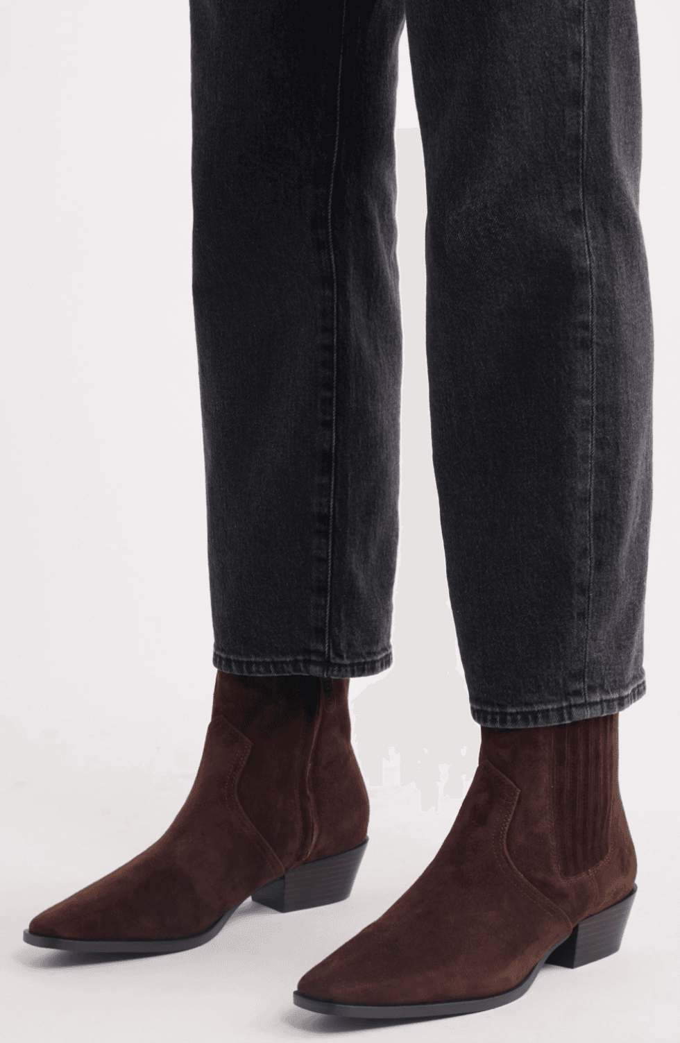 Brown suede ankle boots with black jeans.