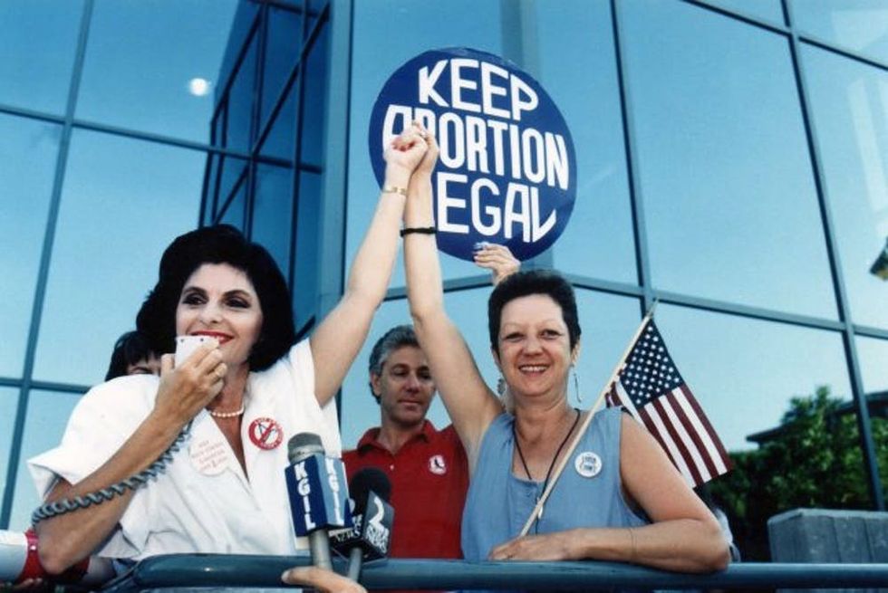 BURBANK, CA - JULY 4 : Attorney Gloria Allred and Norma McCorvey (R),'Jane Roe' plaintiff from Landmark court case Roe vs. Wade during Pro Choice Rally, July 4, 1989 in Burbank, California. (Photo by Bob Riha, Jr./Getty Images)