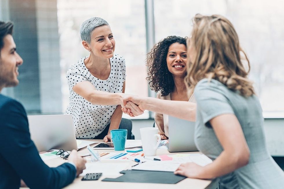 Business persons handshaking at a business meeting