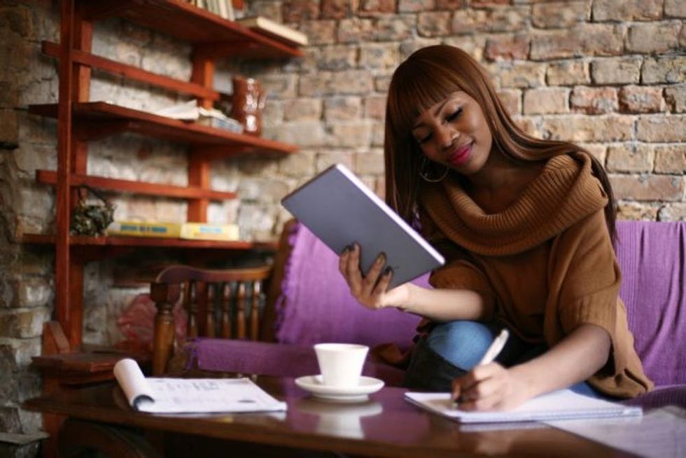 Business woman working journal writing