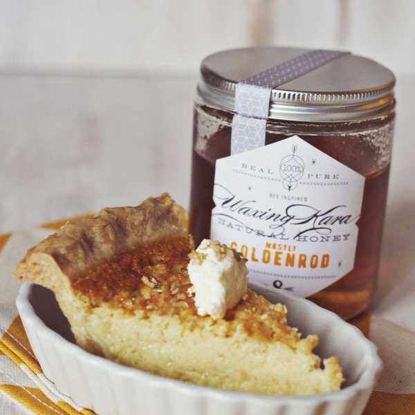 buttermilk and honey pie with a dollop of cream sitting in a creme br\u00fbl\u00e9e dish