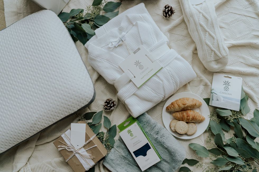 cariloha products, including a robe, socks, towels, pillows, etc