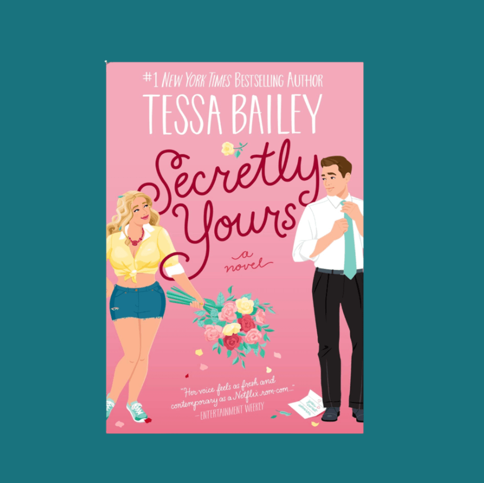 Cartoon couple on pink book cover, "Secretly Yours" by Tessa Bailey.
