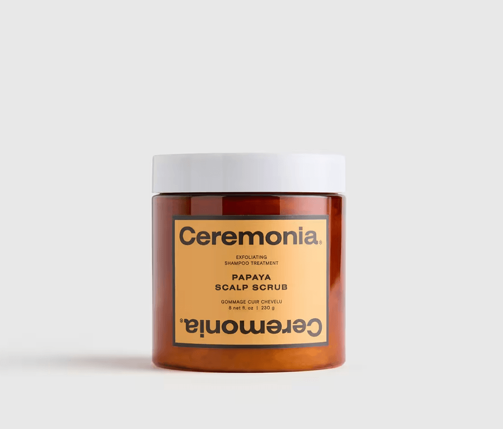 Ceremonia Papaya Scalp Scrub in a brown jar with a white lid on a gray background.