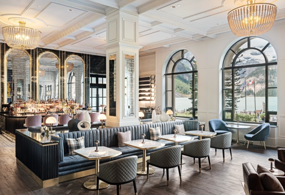 Chic caf\u00e9 with elegant d\u00e9cor, large windows, and stunning lake and mountain views.