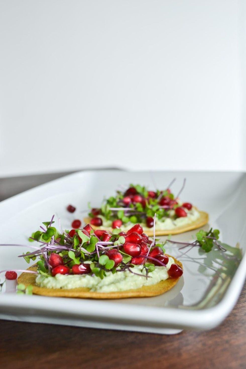 chickpea blini with pomegranate seeds
