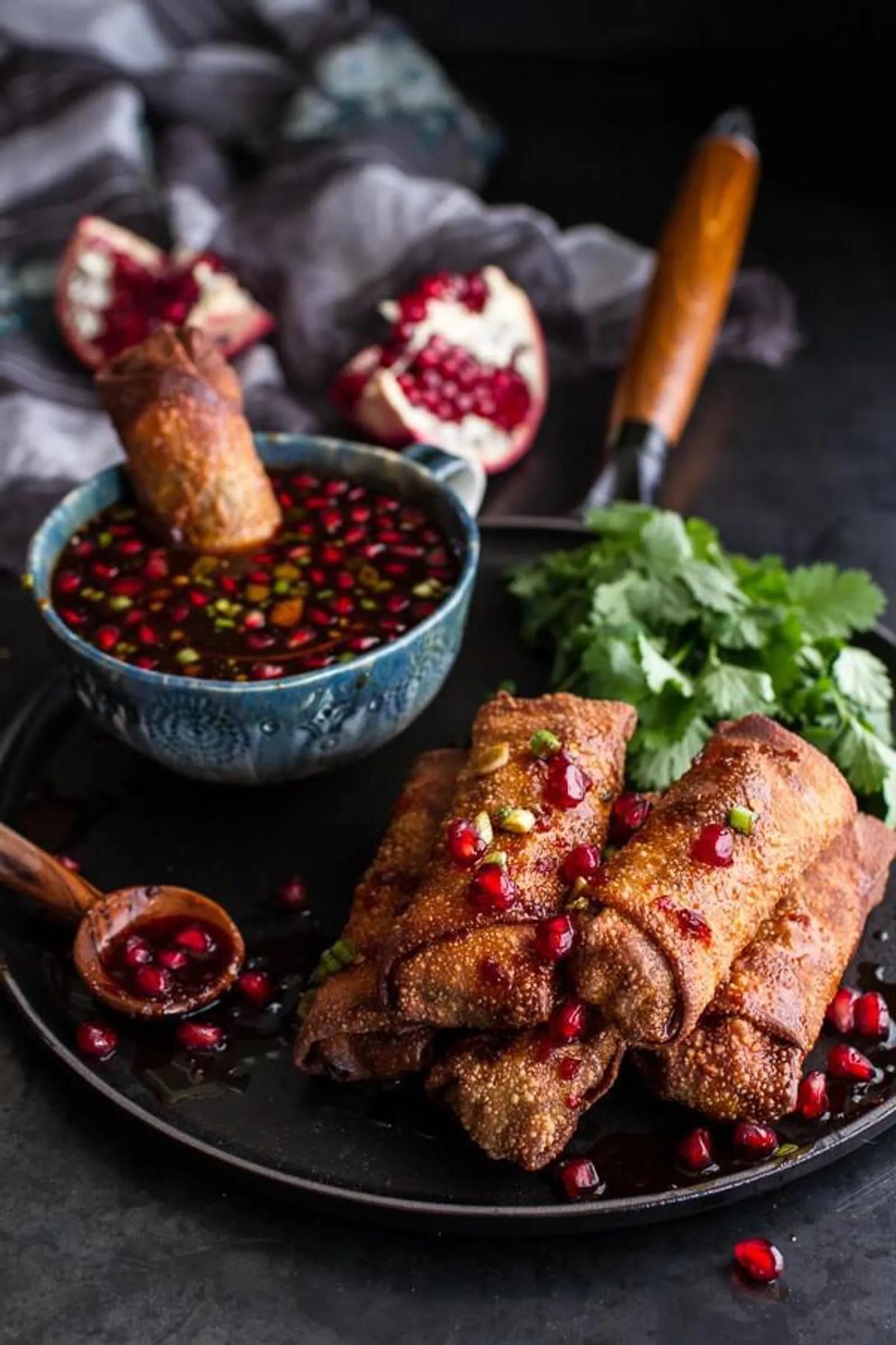 Christmas appetizer recipe of Chinese Chicken and Brussels Sprouts Egg Rolls With Sweet Chile Pomegranate Sauce