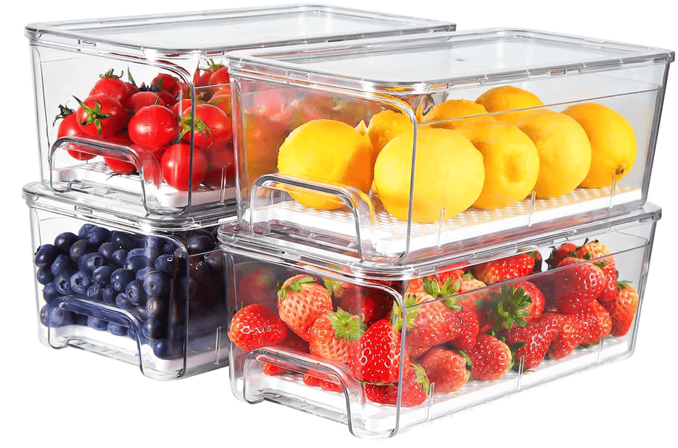 Clear containers holding tomatoes, lemons, blueberries, and strawberries.