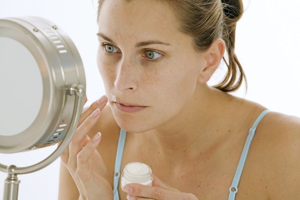 Close-Up of Woman Applying Cream