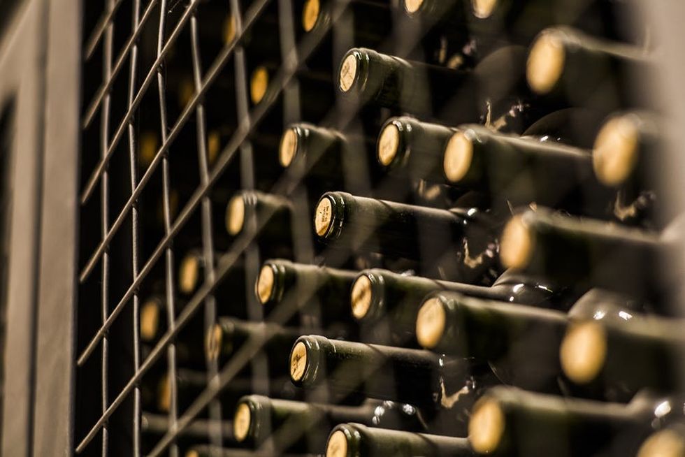 Close up shot of wine bottles in wine cellar, Mendoza, Argentina