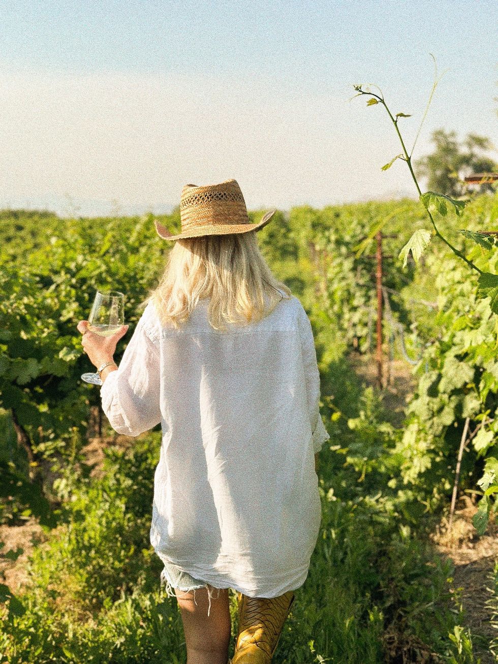 coastal cowgirl drinking wine