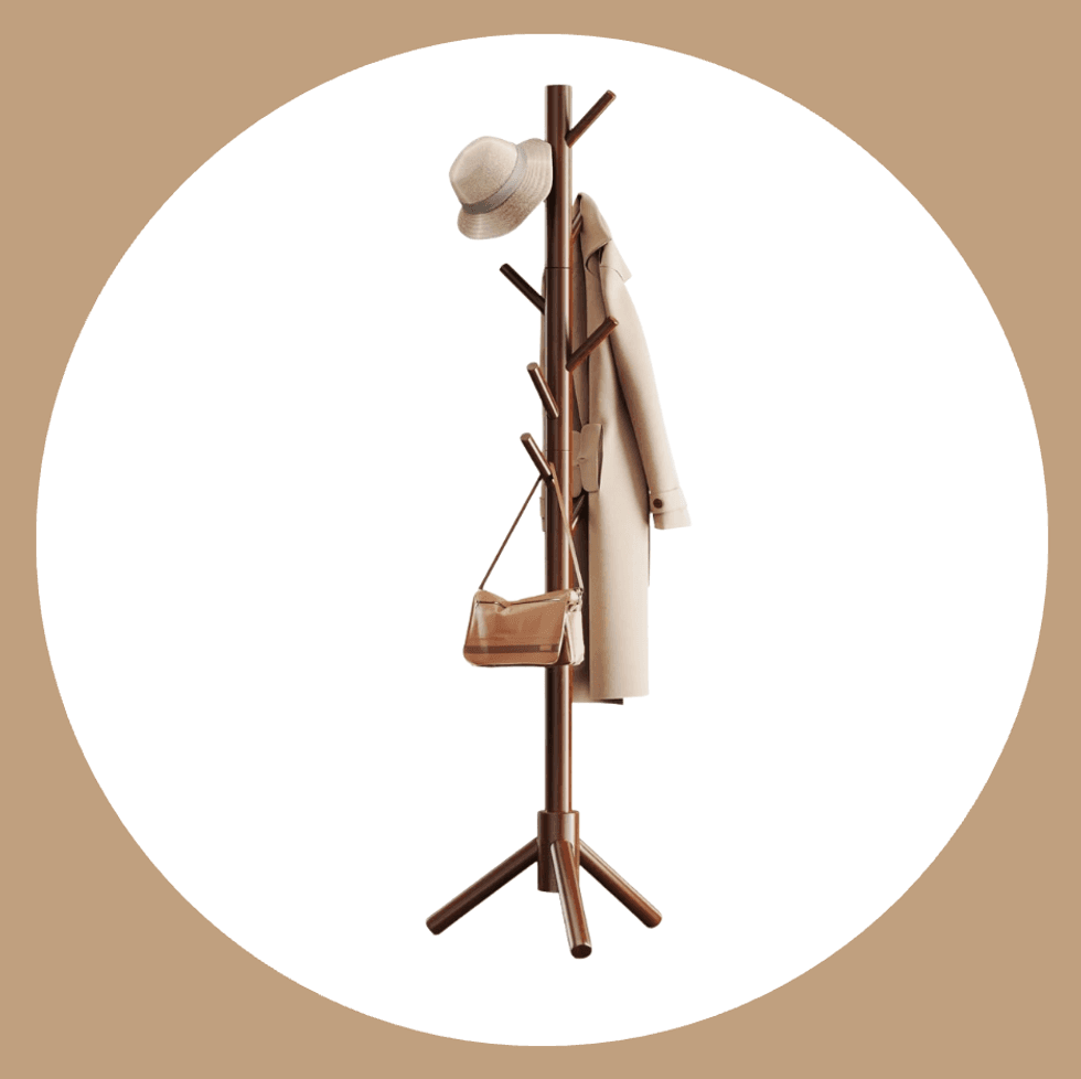 Coat rack with hat, beige coat, and handbag against a white and beige background.