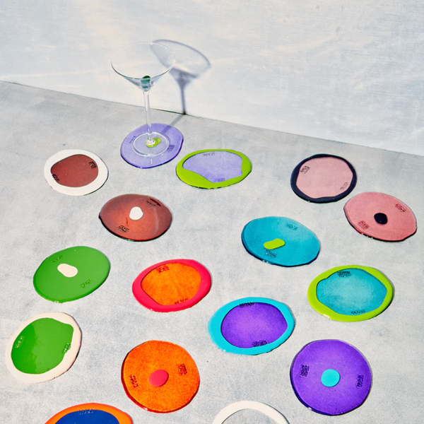 coffee table decor, including coasters, books, candles and trays